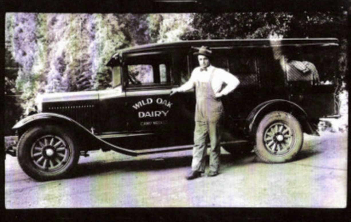 Vintage Wild Oak Dairy delivery truck with driver